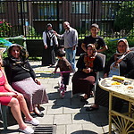 This photograph was minimally posed. This is how I met this neighbourhood. They were out enjoying the sun together and doing the carpets. The samovar had just been put away.