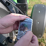 Farmer Henk Timmer shows an image of his 1st favourite tractor whilst riding his 2nd favourite